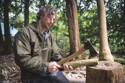 bushcraft instructor using axe