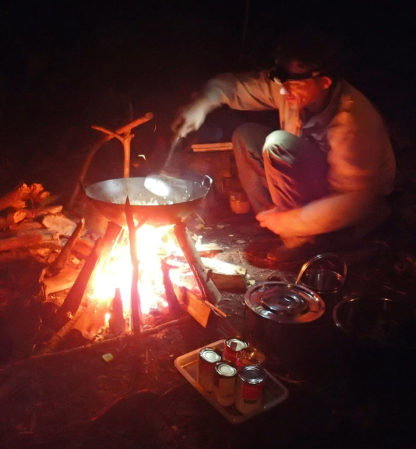 cooking in the jungle on a wok