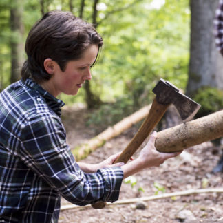 Bushcraft Instructor Heather splitting with Axe